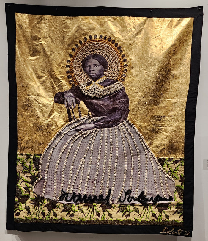 mixed media tapestry of Momma Moses, embellished with fabric and shells
