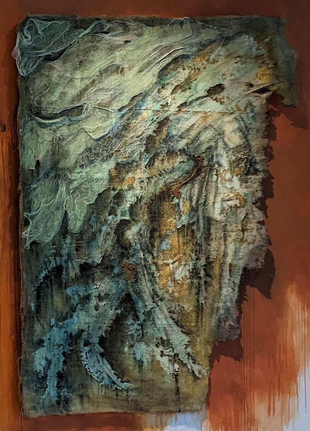 expressionistic painting filled with green and brown hues; hidden in the painting is a portrait