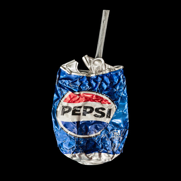 Photographic print of a crushed Pepsi can
