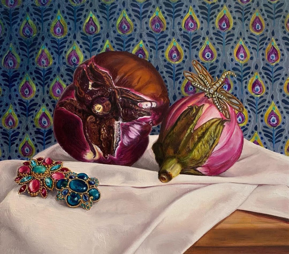 still life painting of two aubergines on a white cloth and two large jeweled pendants; the background features a wallpapered pattern 