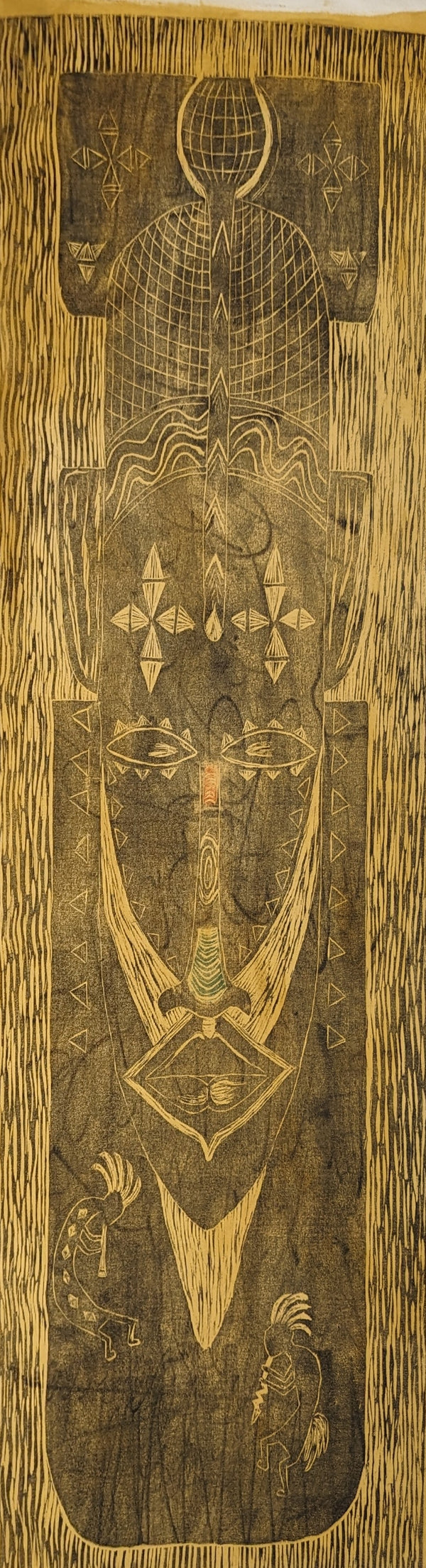 ink print of an African mask on raw canvas