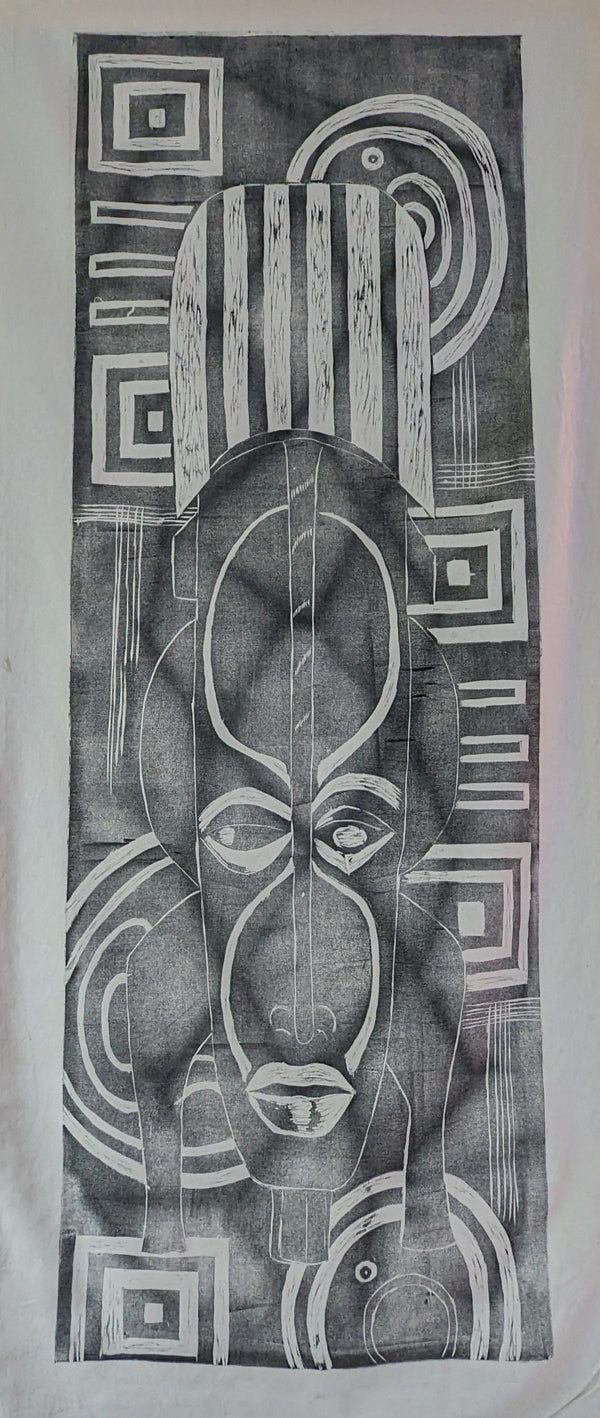 ink print of an African mask on raw canvas